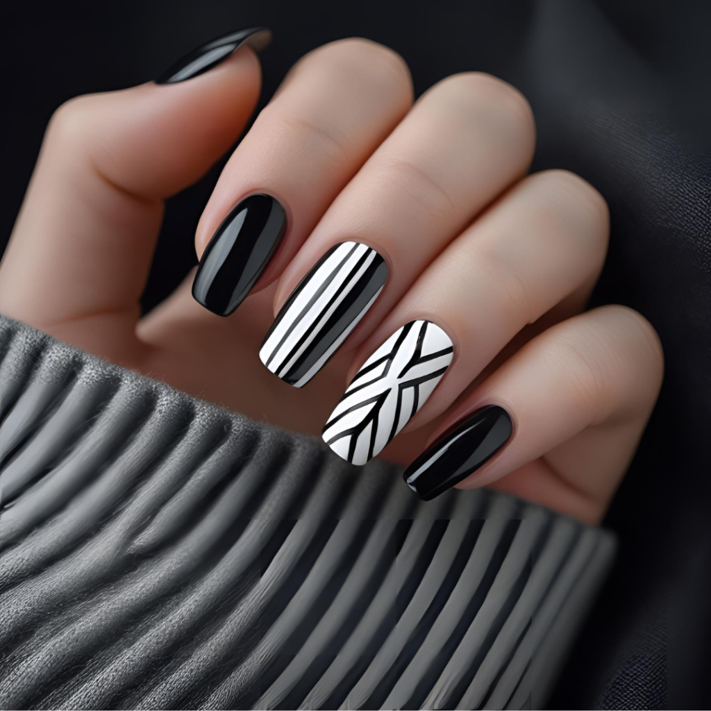 Nail Art Ideas 2025: Simple, Elegant & Trending Designs You’ll Love 13 Bold black and white nail art with modern geometric design.