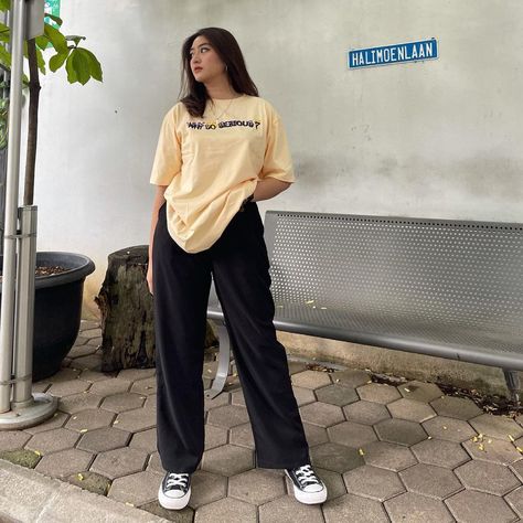 Casual baggy t-shirt for women rooftop DSLR portrait