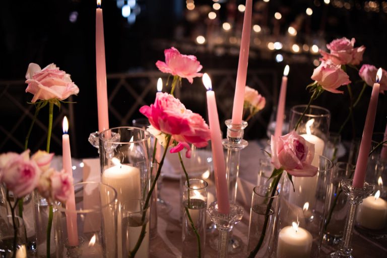 Elegant Wedding Centerpieces Flowers arrangement with white roses, hydrangeas, and soft candlelight on a beautifully decorated reception table