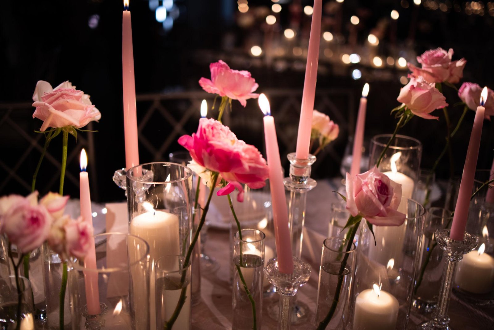 Elegant Wedding Centerpieces Flowers arrangement with white roses, hydrangeas, and soft candlelight on a beautifully decorated reception table