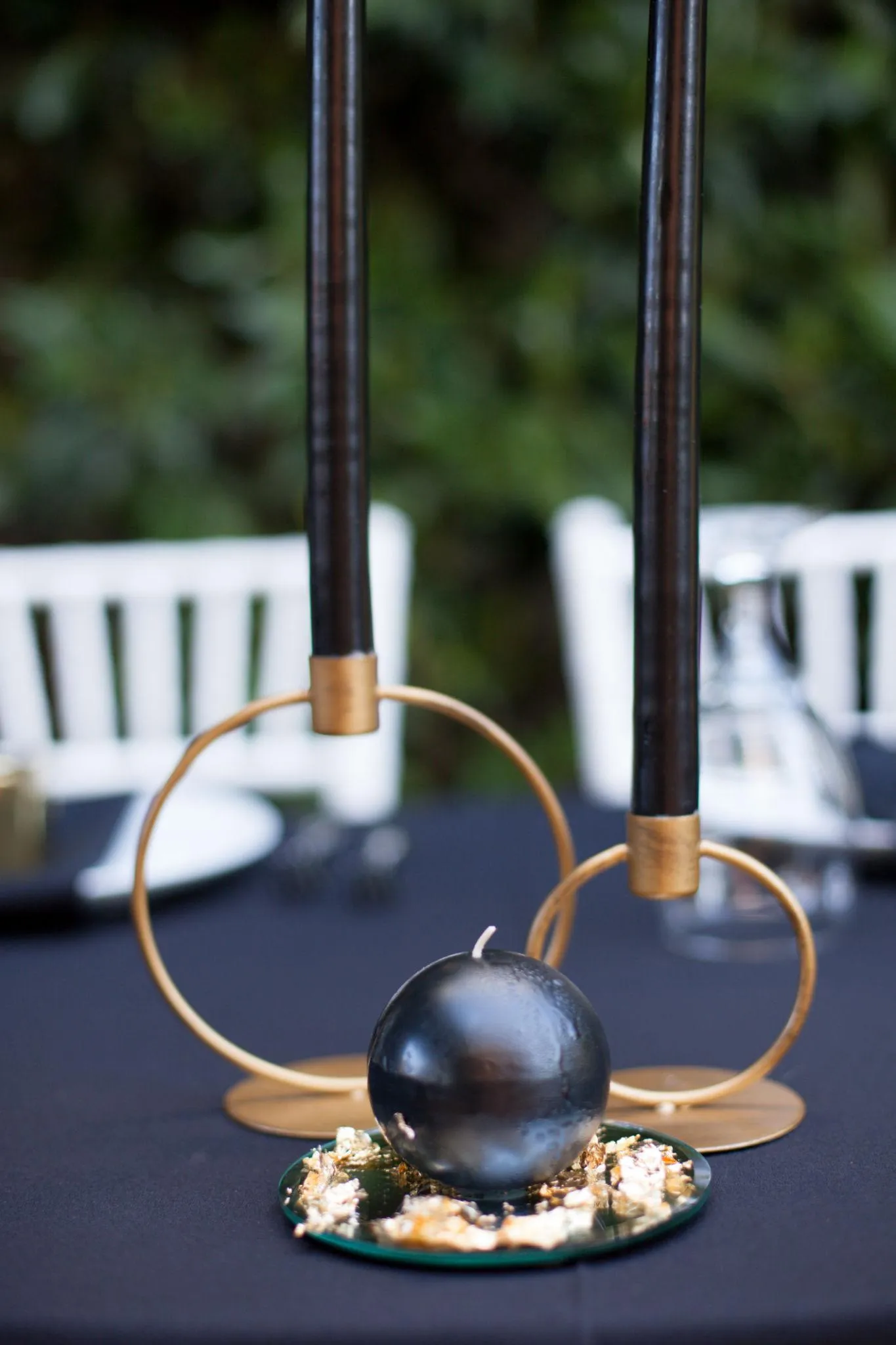 elegant black tie wedding reception with gold decor and candlelight in a luxury ballroom