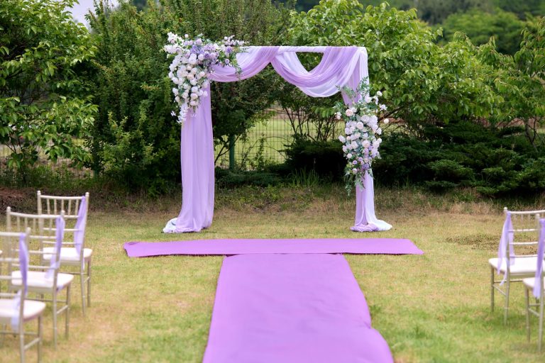romantic lavender wedding reception decor with pastel flowers and candlelight