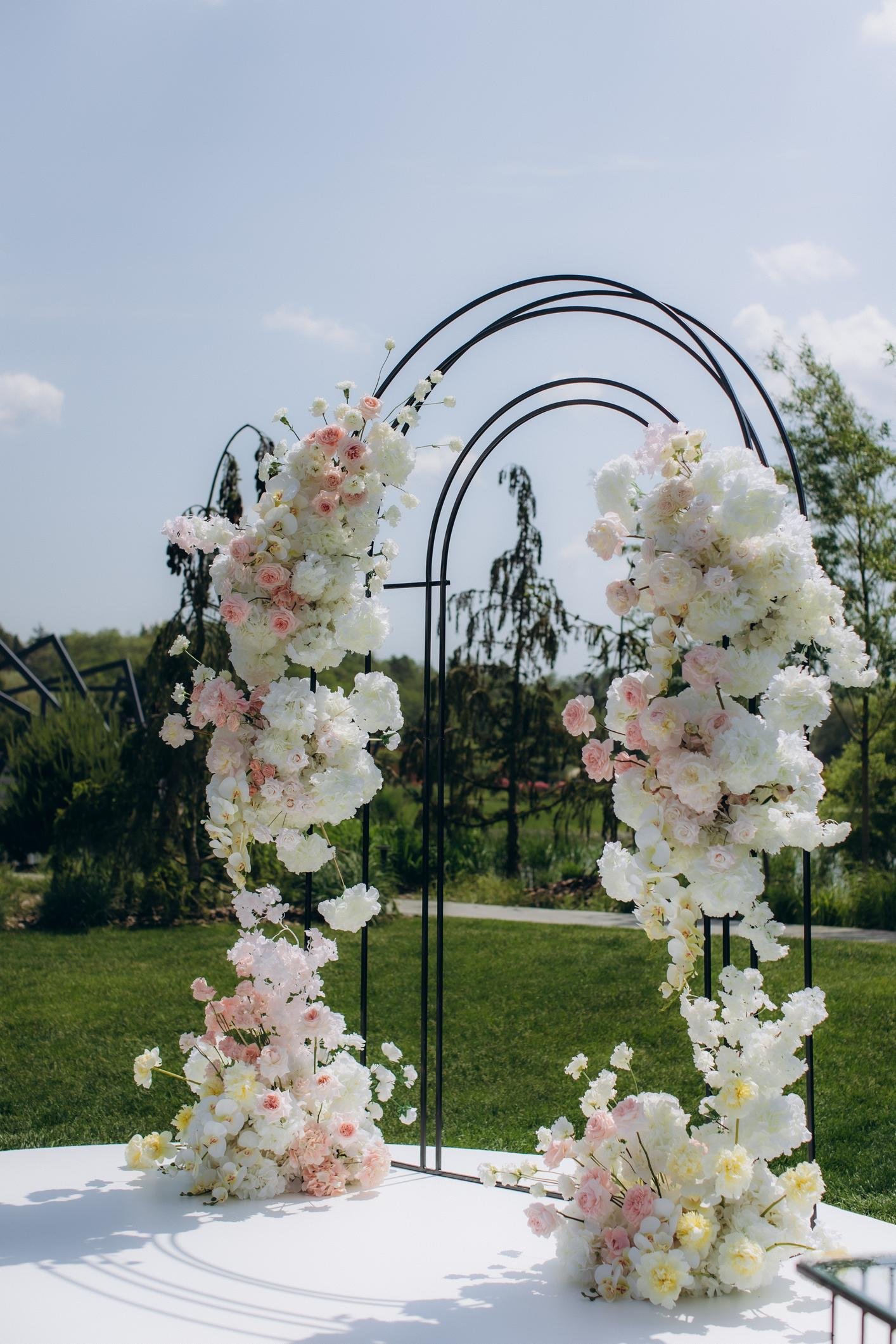 elegant neutral wedding reception decor with ivory flowers and champagne table styling