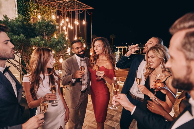 Stylish celebration themed feature image showing elegantly dressed friends enjoying a luxury party with warm lights, modern decorations, balloons, and social media inspired festive aesthetics for special occasions.