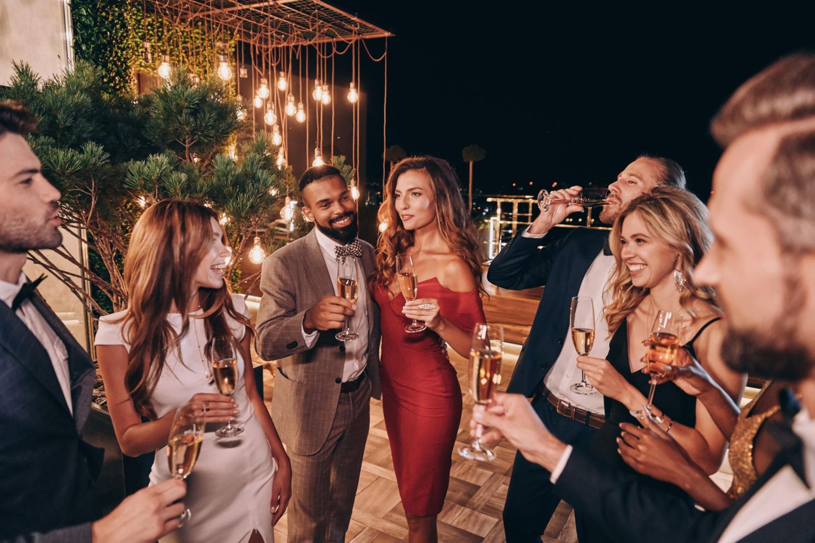 Stylish celebration themed feature image showing elegantly dressed friends enjoying a luxury party with warm lights, modern decorations, balloons, and social media inspired festive aesthetics for special occasions.