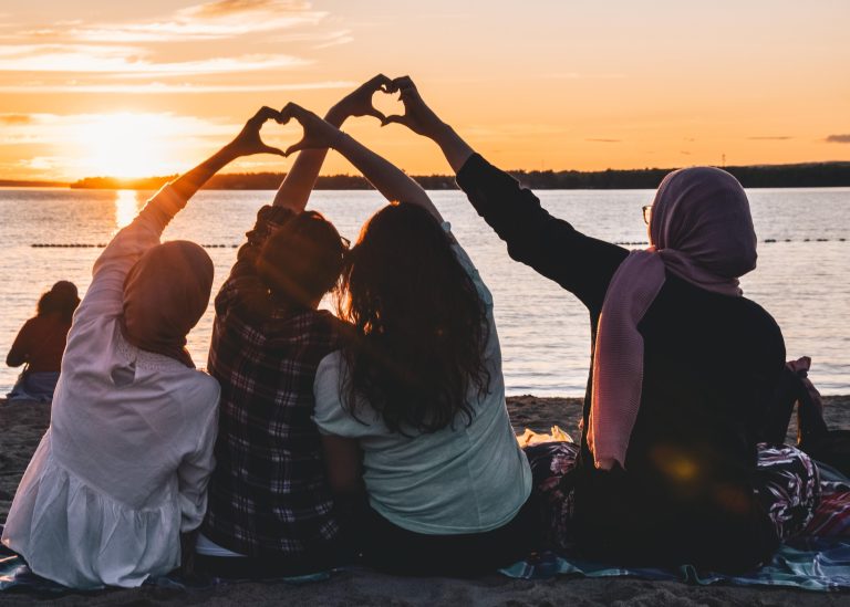 Friends laughing together during a Happy Friendship Day celebration, enjoying a joyful outdoor gathering filled with friendship and memorable moments.