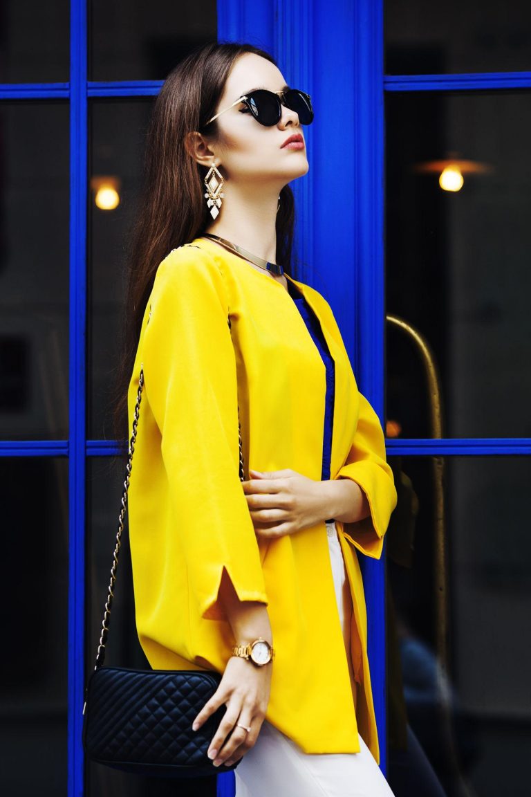 Stylish woman expressing confidence through a refined wardrobe, representing personal style development and fashion growth.