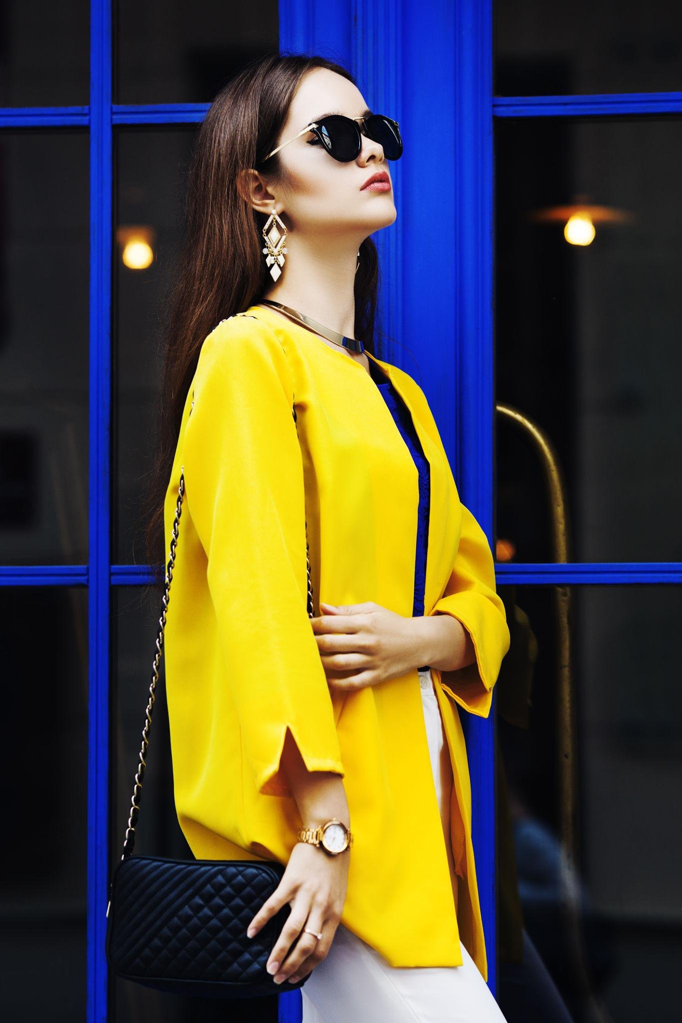 Stylish woman expressing confidence through a refined wardrobe, representing personal style development and fashion growth.