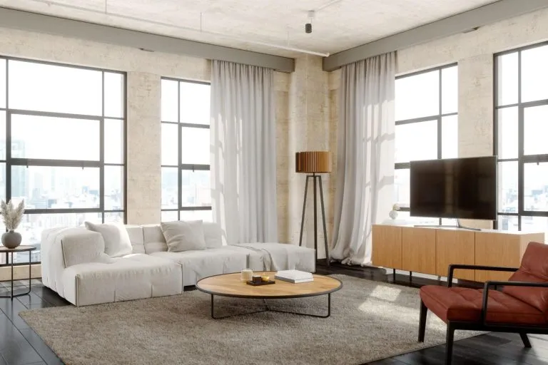 Smart apartment interior with modern furniture, clever storage, and bright natural lighting.