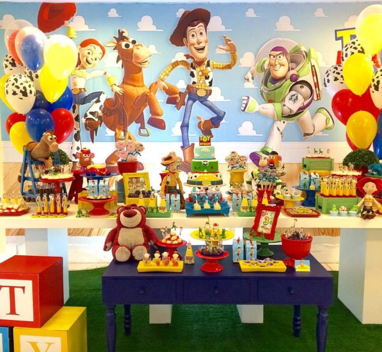 Colorful Toy Story birthday party setup featuring Woody, Buzz Lightyear, Jessie, Bullseye, themed balloon decorations, character dessert table, birthday cake, party favors, and Andy's cloud wallpaper backdrop for a fun kids' celebration.