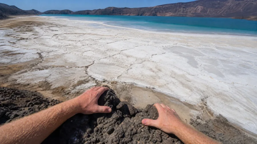 Photograph the Salt Flats of Lake Assal from Volcanic Ridges